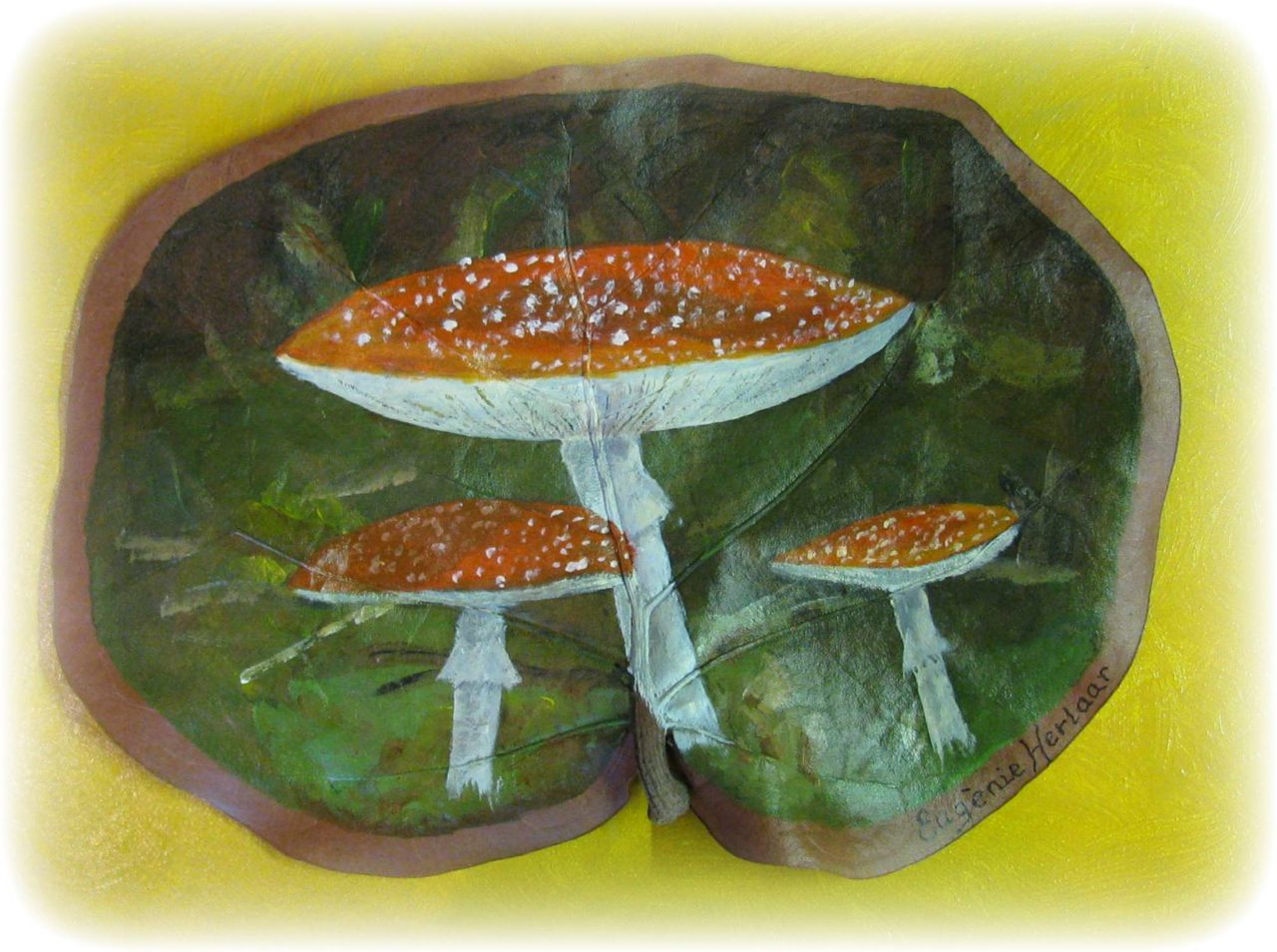 Painting of a fly agaric mushroom on a dried Seagrape leaf